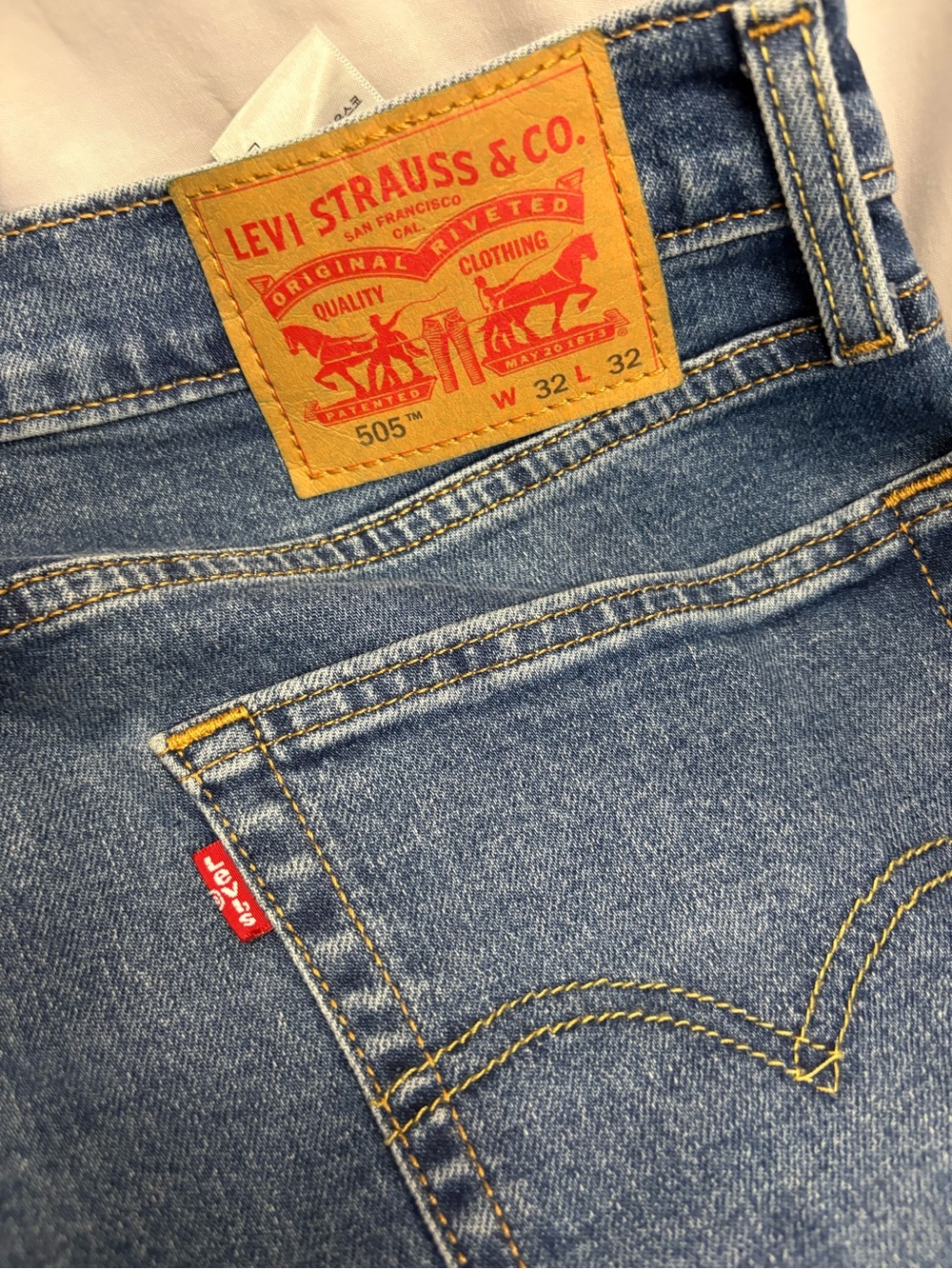 Levi's Men’s 505 Blue Denim Jeans with Tan Leather Patch and Red Tab